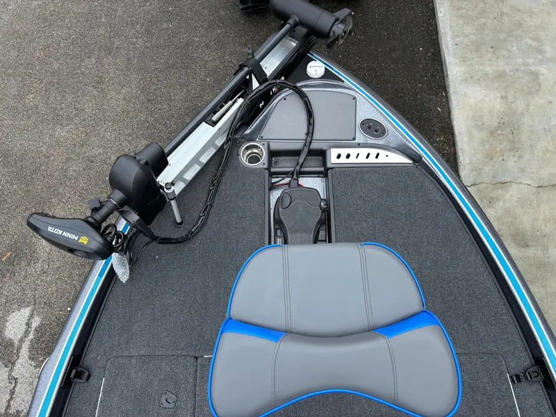 Slide: The Image of 2024 Triton 19 TrX boat deck with seat and trolling motor. - 4