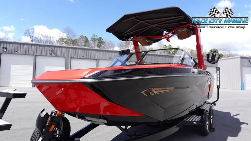 Slide: The Image of 2024 Nautique Super Air Nautique G23 boat in red and black at Race City Marine. - 12