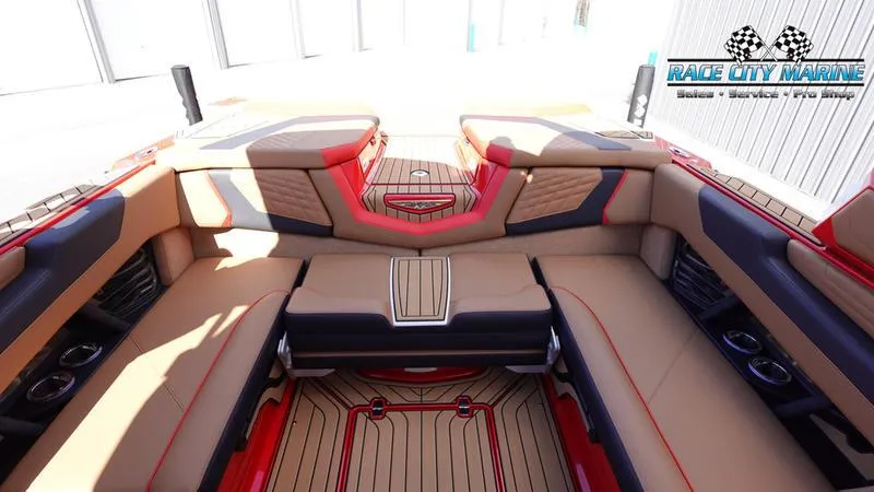 Slide: The Image of 2024 Nautique Super Air Nautique G23 interior with tan and red upholstery. - 15