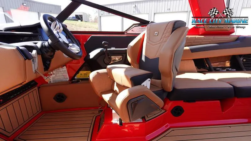 Slide: The Image of 2024 Nautique Super Air Nautique G23 interior with tan and red accents. - 22
