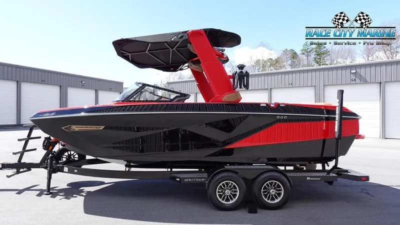 Slide: The Image of 2024 Nautique Super Air Nautique G23 boat on trailer at Race City Marine. - 24