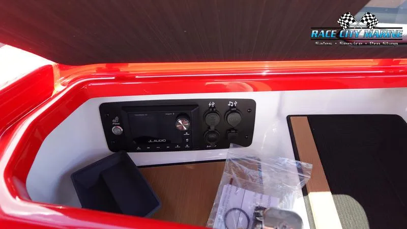Slide: The Image of 2024 Nautique Super Air Nautique G23 control panel with JL Audio system. - 32