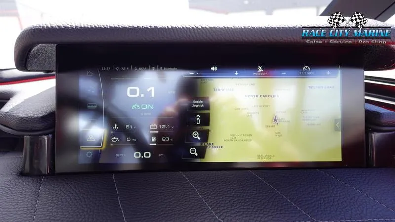 Slide: The Image of 2024 Nautique Super Air Nautique G23 dashboard display with navigation and control settings. - 33