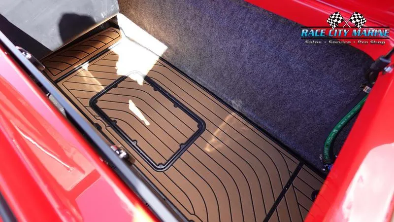 Slide: The Image of 2024 Nautique Super Air Nautique G23 storage compartment with custom flooring. - 45