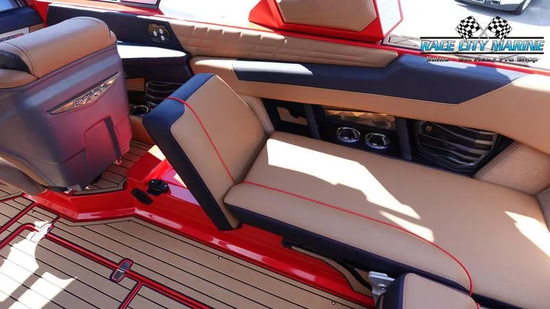 Slide: The Image of 2024 Nautique Super Air Nautique G23 interior with tan and red upholstery. - 49
