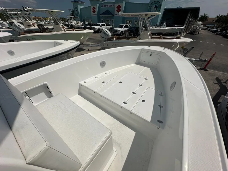 Slide: The Image of 2023 Ocean Master 27 boat interior at a yacht dealership. - 5