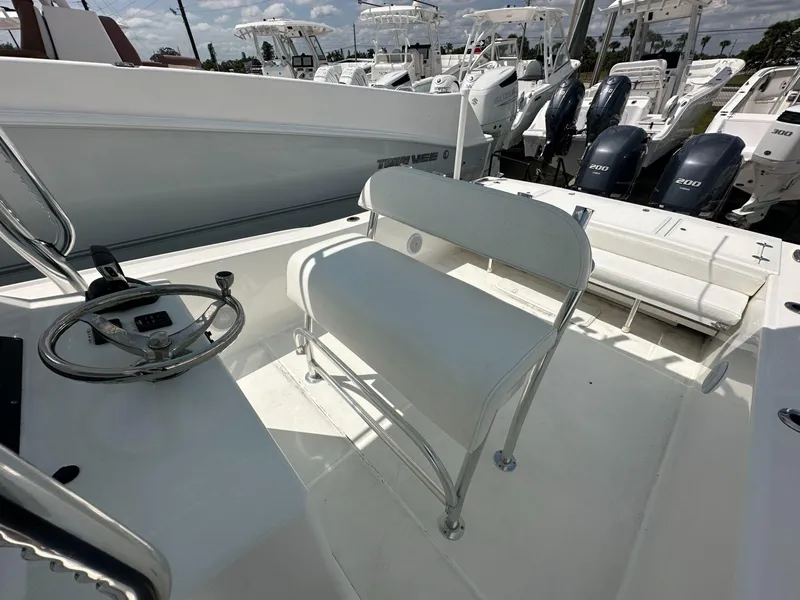 Slide: The Image of 2023 Ocean Master 27 boat interior with steering wheel and seating. - 8