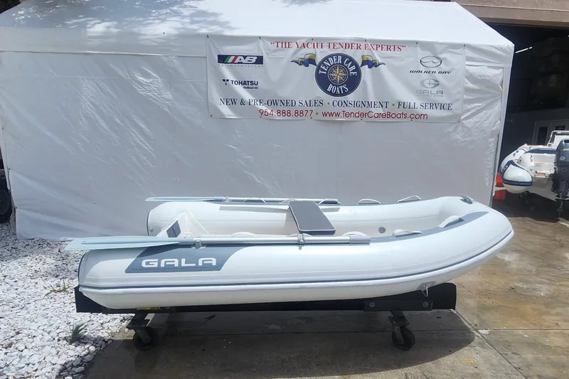 Slide: The Image of 2022 Gala A270HW inflatable boat on display at a dealership. - 2