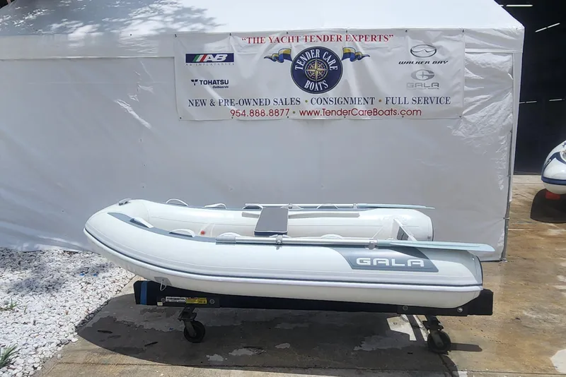 Slide: The Image of 2022 Gala A270HW inflatable boat displayed at a yacht tender sales tent. - 3