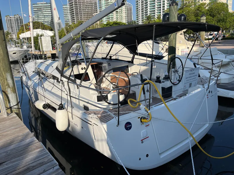 The Image of 2024 Jeanneau Sun Odyssey 440 sailboat docked at marina. - 0