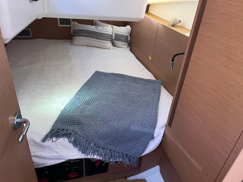 Slide: The Image of Cozy bedroom in 2024 Jeanneau Sun Odyssey 440 sailboat with modern decor. - 8