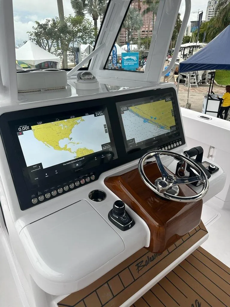 Slide: The Image of Control console of 2024 Bahama 41' Open Fisherman GT with dual navigation screens. - 10