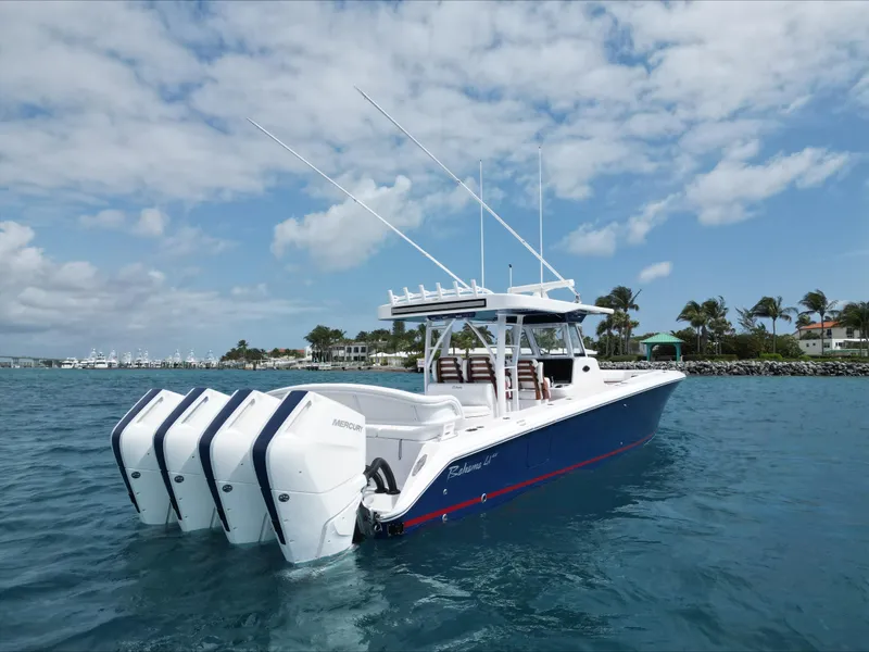 Slide: The Image of 2024 Bahama 41' Open Fisherman GT with quad Mercury outboard engines on the water. - 5
