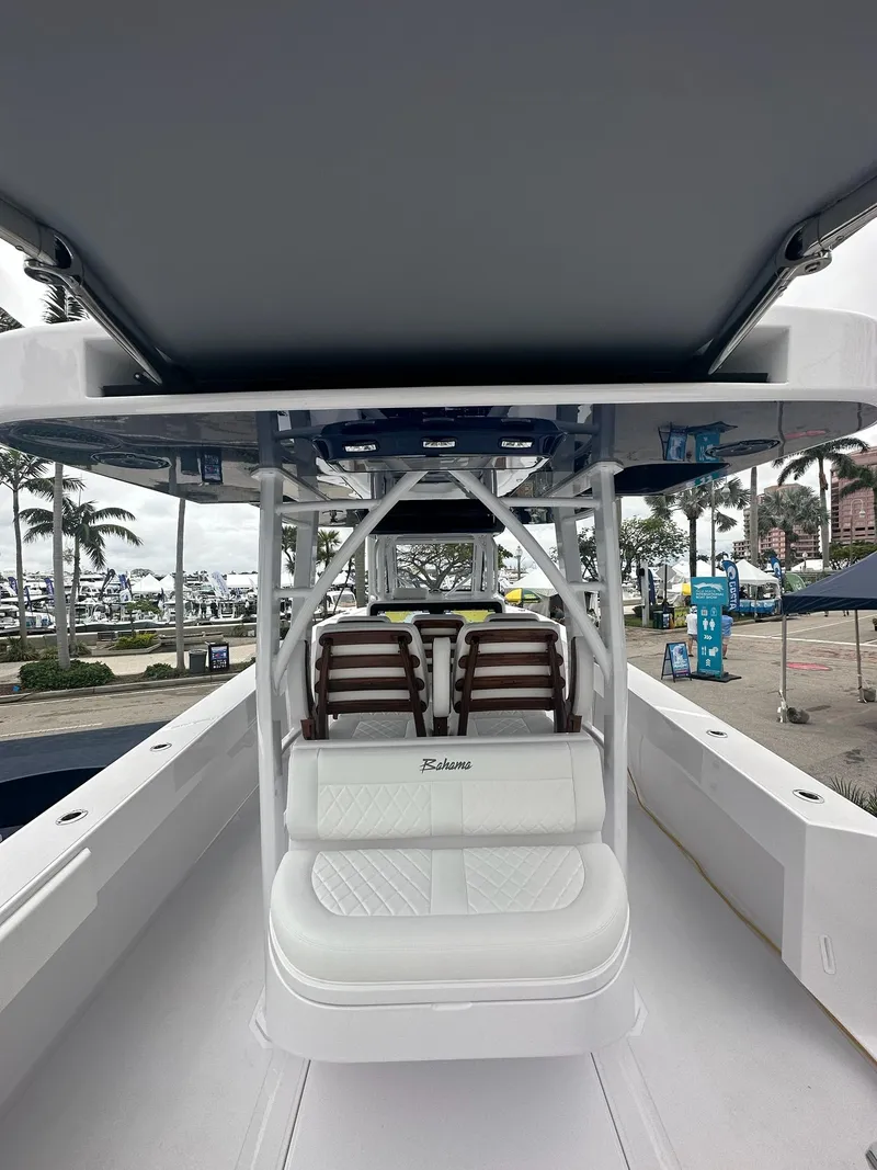 Slide: The Image of 2024 Bahama 41' Open Fisherman GT boat interior with seating and console. - 8