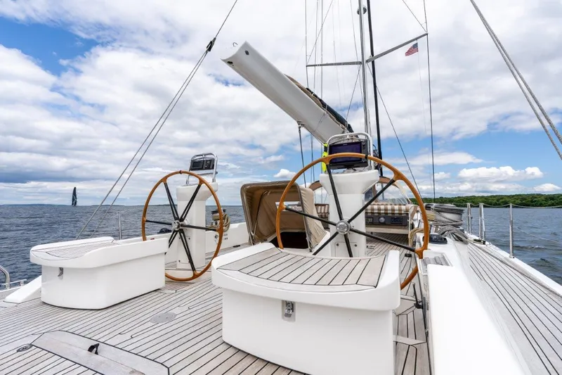 Slide: The Image of Nautor Swan 82S 2005 yacht deck with dual steering wheels on open sea. - 12