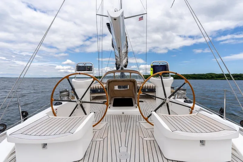 Slide: The Image of Nautor Swan 82S 2005 yacht deck with dual steering wheels on open water. - 13