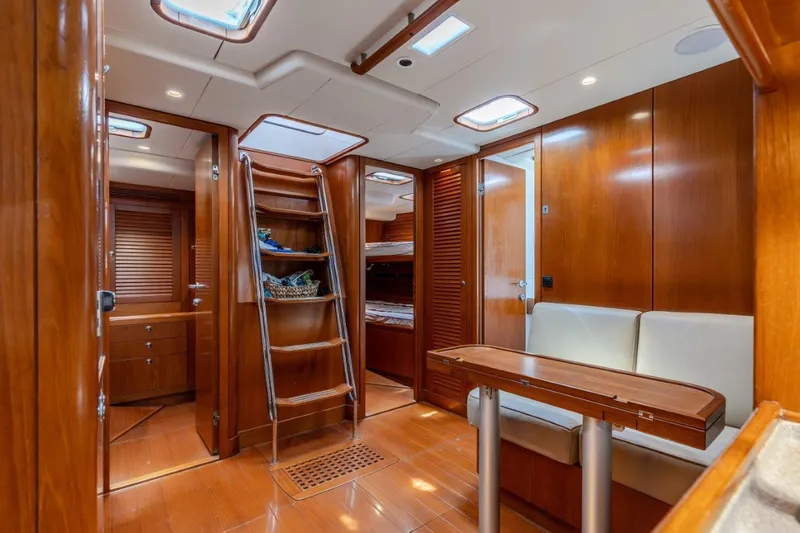 Slide: The Image of Luxurious interior of 2005 Nautor Swan 82S yacht with wooden finishes and modern amenities. - 19