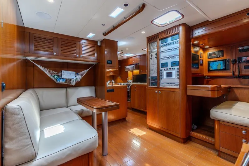 Slide: The Image of Luxurious interior of 2005 Nautor Swan 82S yacht with wooden finishes and modern amenities. - 21