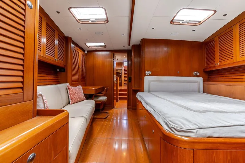 Slide: The Image of Luxurious cabin interior of 2005 Nautor Swan 82S yacht with wooden finishes and cozy seating. - 23
