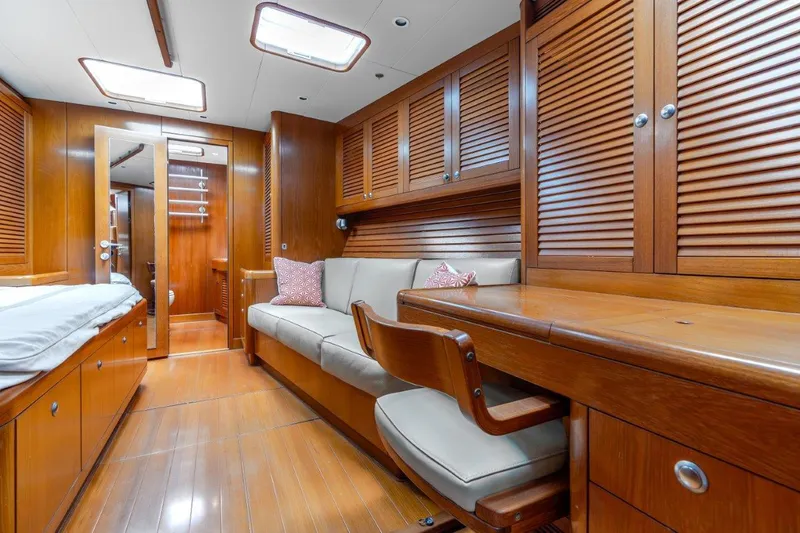 Slide: The Image of Luxurious interior of 2005 Nautor Swan 82S yacht with wooden furnishings and cozy seating. - 25