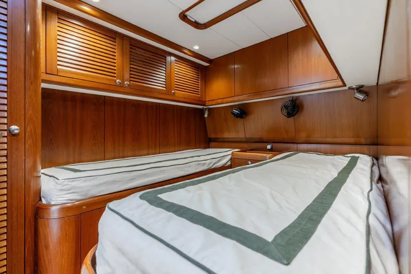 Slide: The Image of Interior cabin of 2005 Nautor Swan 82S yacht with wooden finishes and twin beds. - 27