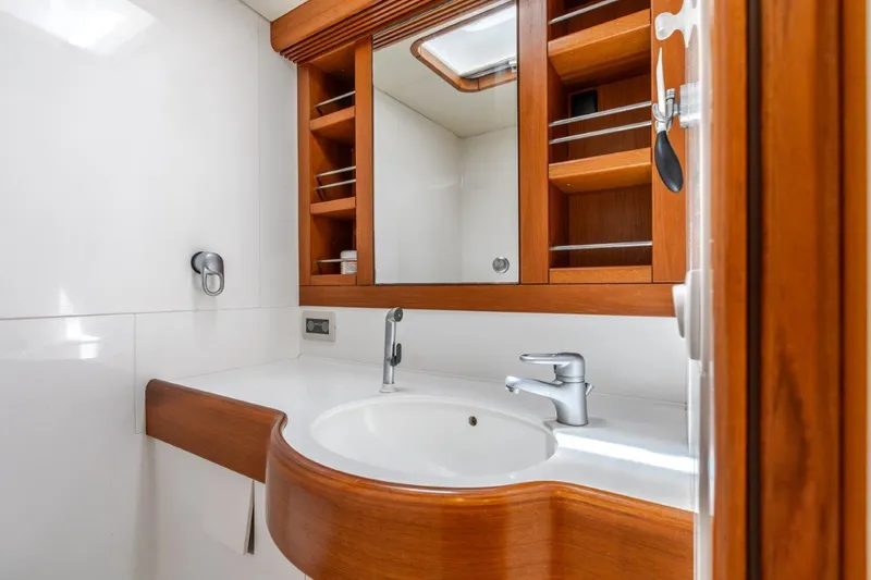 Slide: The Image of Luxurious bathroom in 2005 Nautor Swan 82S yacht with wooden cabinetry and modern fixtures. - 29