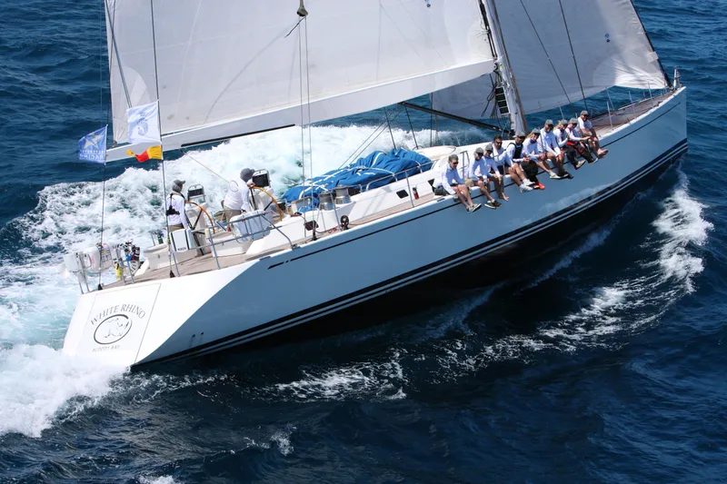 Slide: The Image of Nautor Swan 82S 2005 sailing yacht with crew on deck in open sea. - 3