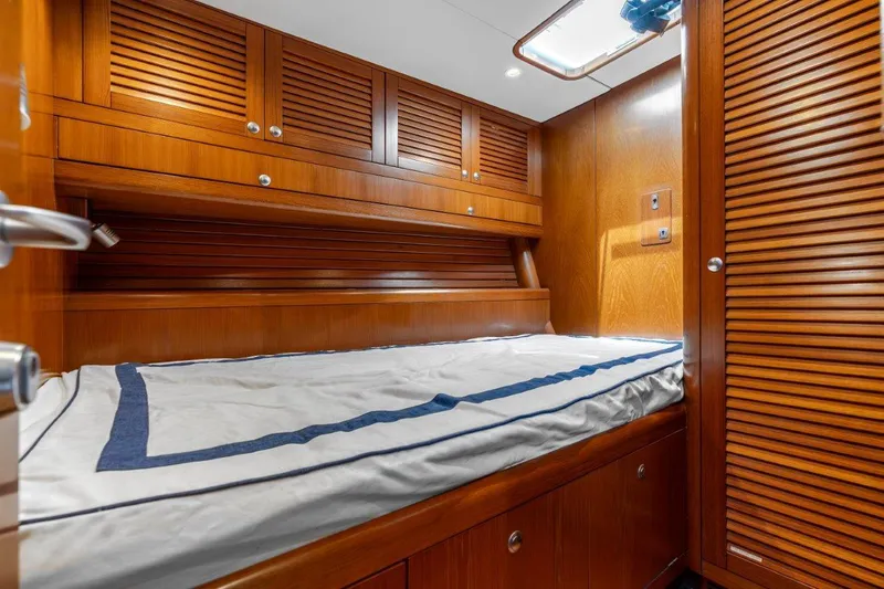Slide: The Image of Luxurious wooden cabin interior of 2005 Nautor Swan 82S yacht with cozy bed. - 30