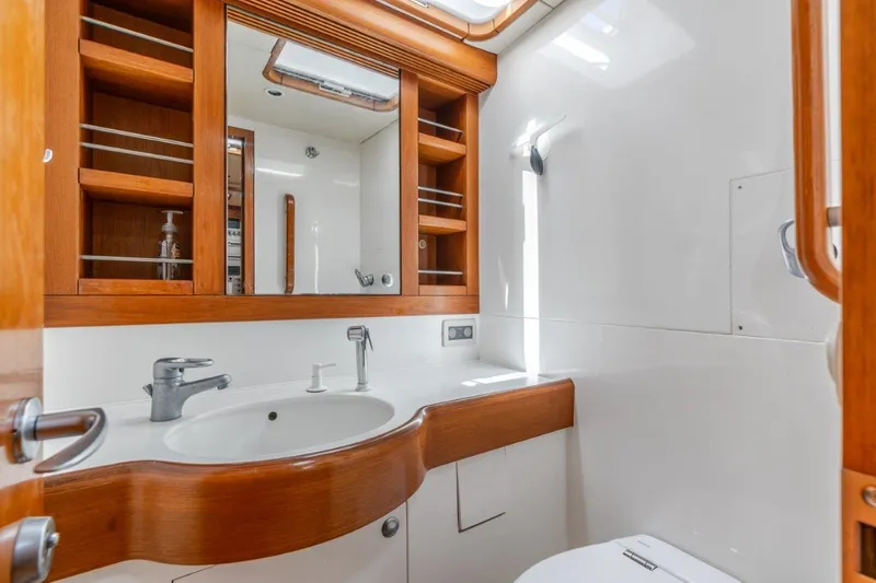 Slide: The Image of Luxurious bathroom in 2005 Nautor Swan 82S yacht with wooden cabinetry and modern fixtures. - 31
