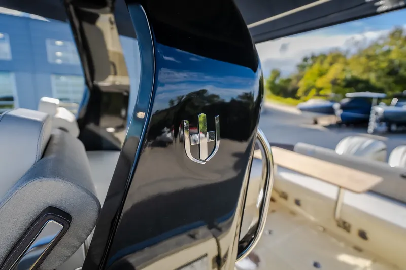 Slide: The Image of 2024 Invictus GT320S boat interior with sleek design and logo detail. - 14
