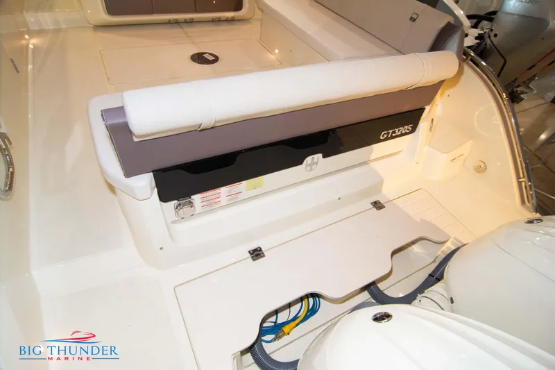 Slide: The Image of 2024 Invictus GT320S boat interior with seating and storage compartments. - 11