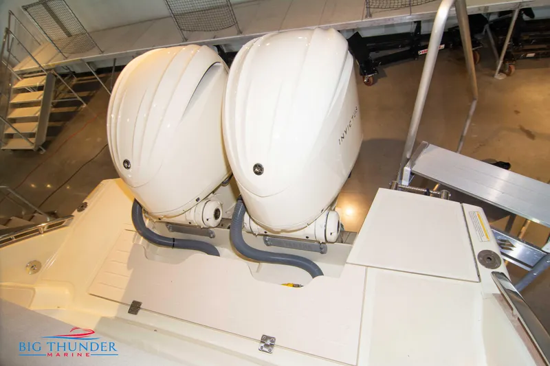 Slide: The Image of 2024 Invictus GT320S boat with dual outboard engines at Big Thunder Marine. - 13