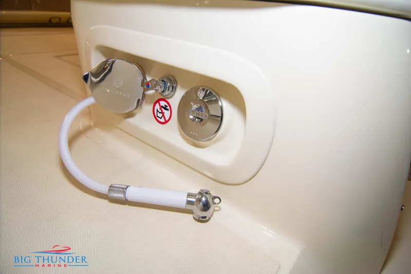 Slide: The Image of Close-up of 2024 Invictus GT320S boat's water hose connection. - 14