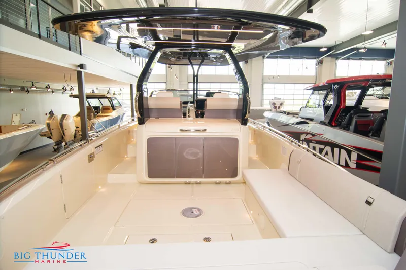 Slide: The Image of 2024 Invictus GT320S luxury boat interior at Big Thunder Marine showroom. - 15