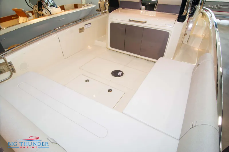Slide: The Image of 2024 Invictus GT320S boat interior with seating and storage compartments. - 16