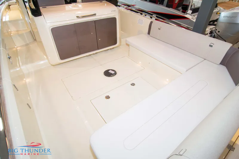 Slide: The Image of 2024 Invictus GT320S boat interior with spacious seating and storage compartments. - 17