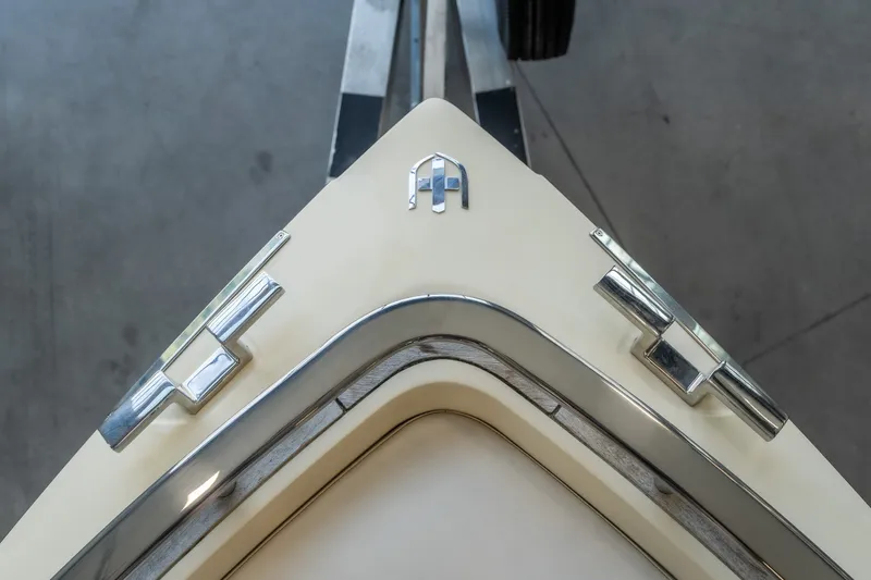 Slide: The Image of Close-up of 2024 Invictus GT320S boat bow with chrome accents and logo. - 29