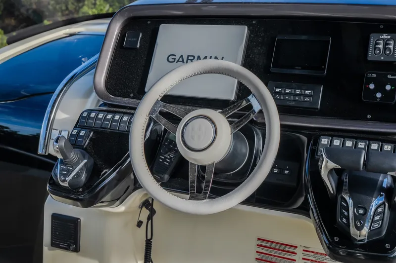 Slide: The Image of 2024 Invictus GT320S dashboard with Garmin navigation and modern controls. - 19