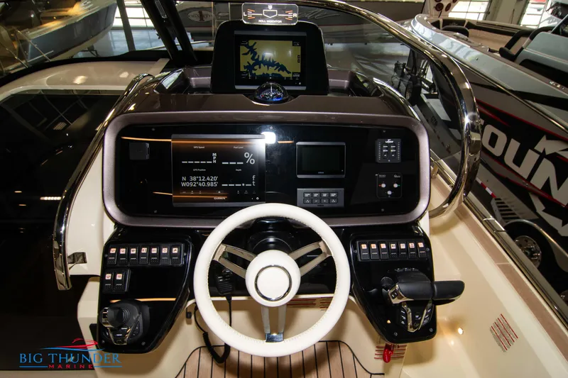 Slide: The Image of 2024 Invictus GT320S boat dashboard with advanced navigation and control systems. - 29