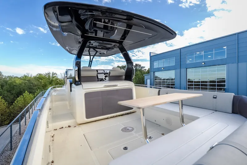 Slide: The Image of 2024 Invictus GT320S luxury boat with sleek design and spacious seating area. - 56