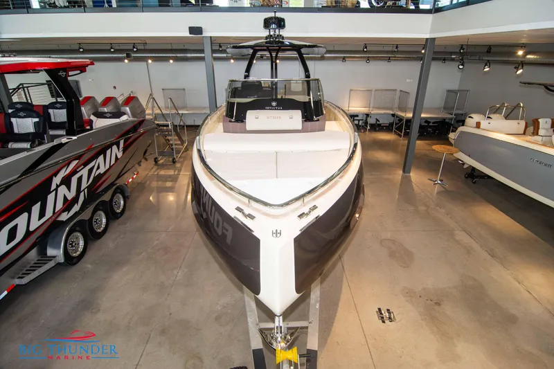 Slide: The Image of 2024 Invictus GT320S luxury boat displayed in showroom. - 4