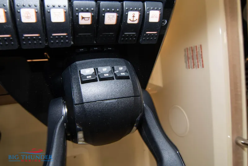 Slide: The Image of Close-up of 2024 Invictus GT320S boat control panel and throttle. - 45