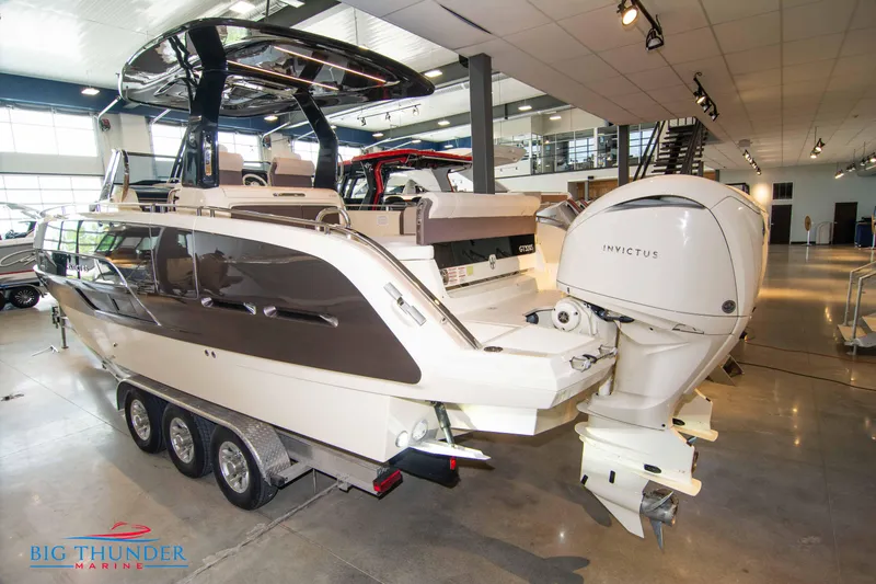 Slide: The Image of 2024 Invictus GT320S luxury boat on display at Big Thunder Marine showroom. - 5