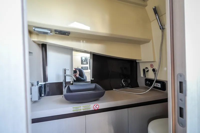 Slide: The Image of 2024 Invictus GT320S yacht bathroom with modern sink and sleek design. - 52