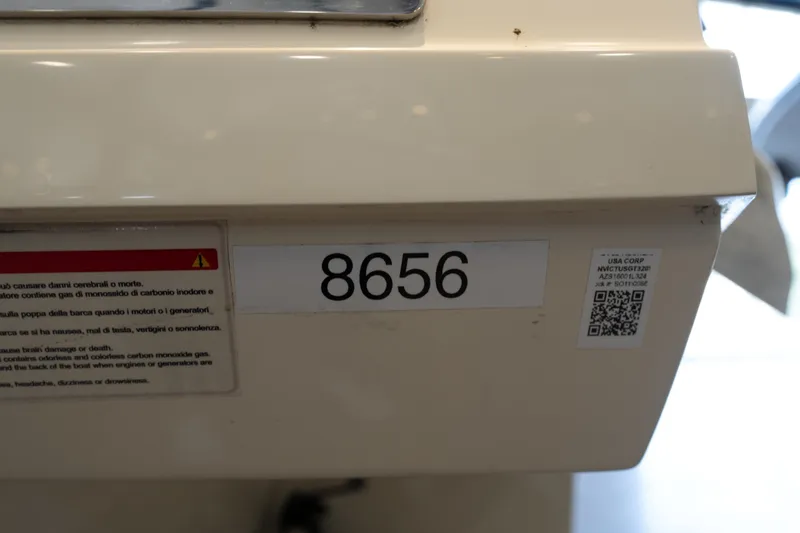 Slide: The Image of Invictus GT320S 2024 model with number 8656 and safety warning label. - 5