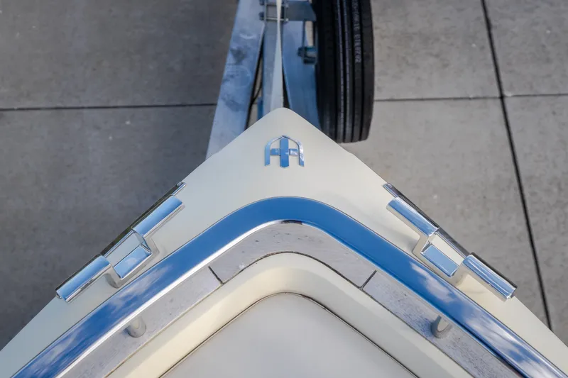Slide: The Image of 2024 Invictus GT320S boat bow with chrome accents and sleek design. - 33