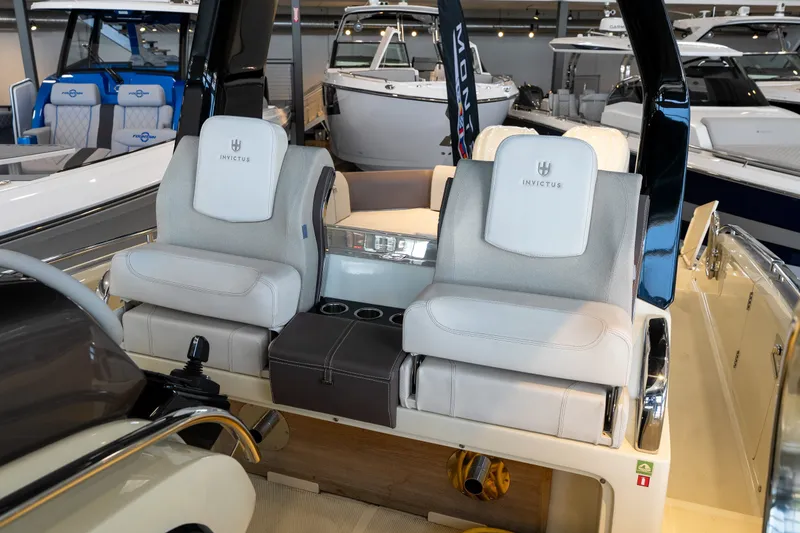 Slide: The Image of 2024 Invictus GT320S luxury boat interior with plush seating and modern design. - 33