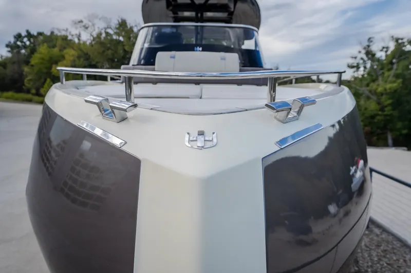 Slide: The Image of 2024 Invictus GT320S yacht front view with sleek design and chrome details. - 60
