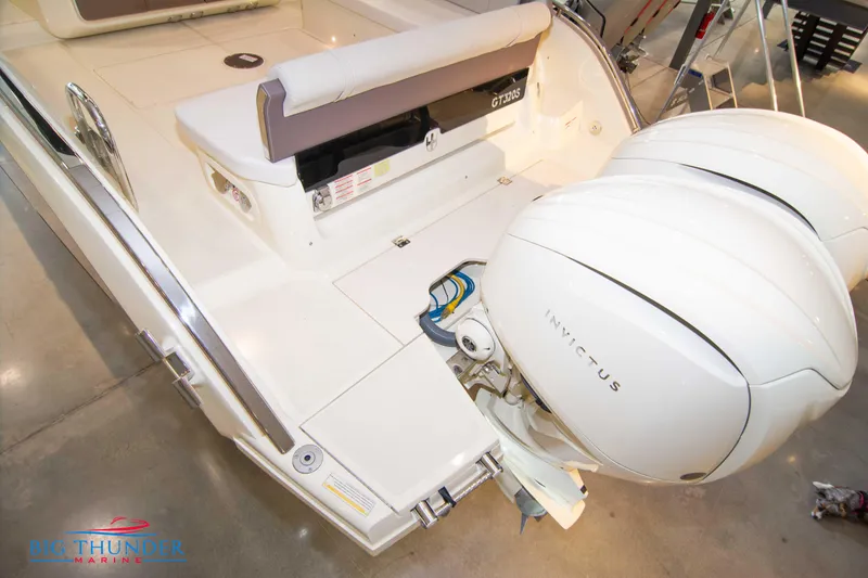 Slide: The Image of 2024 Invictus GT320S boat stern with dual engines at Big Thunder Marine. - 9
