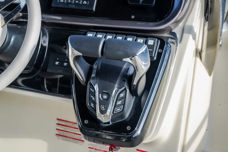 Slide: The Image of Throttle controls on 2024 Invictus GT320S boat dashboard, featuring modern design and functionality. - 20